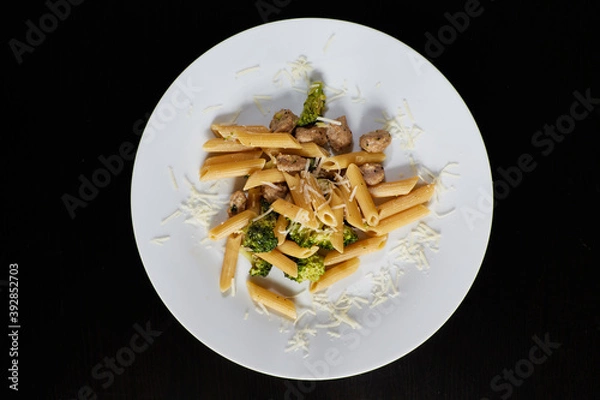 Obraz photography of a plate of macaroni with broccoli and sausages