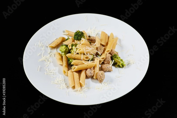 Obraz photography of a plate of macaroni with broccoli and sausages