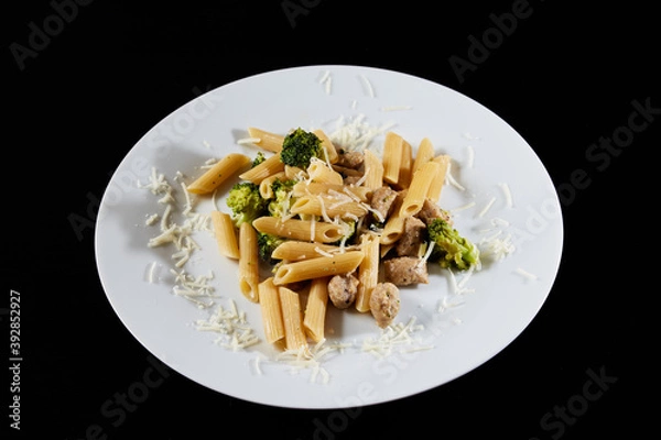 Obraz photography of a plate of macaroni with broccoli and sausages