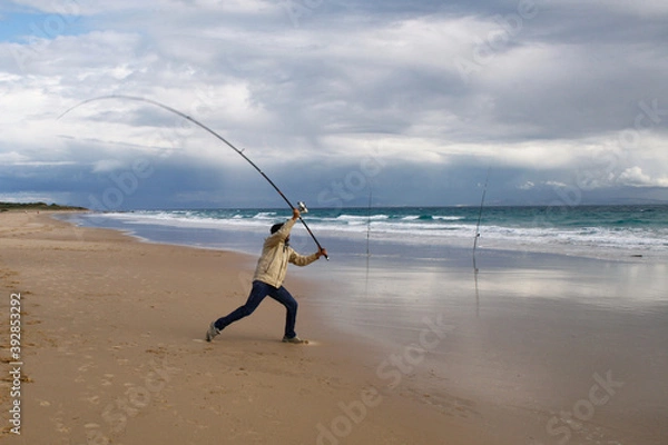 Obraz photograph of a fisherman on the beach
