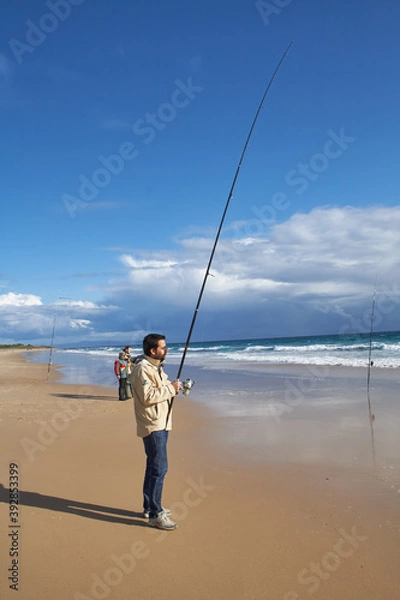 Obraz photograph of a fisherman on the beach
