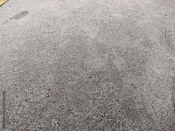 Fototapeta ice covered pavement surface texture and background closeup photo