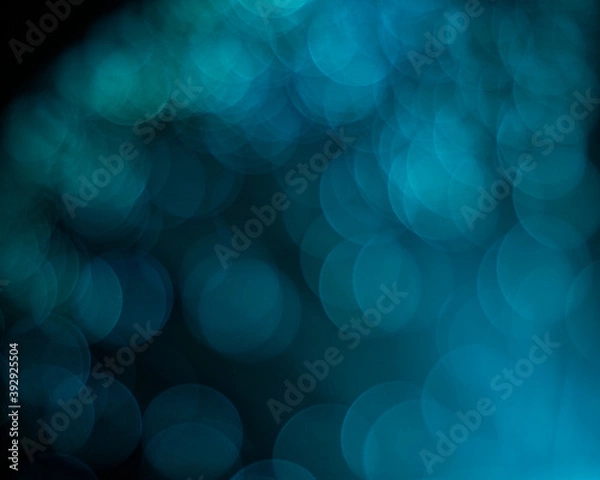 Obraz An abstract aqua colored blurred bokeh background with copy space