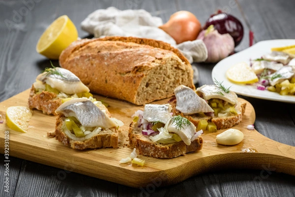 Obraz sandwiches with herring, onion and cucumber