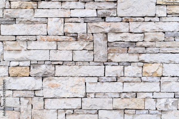 Fototapeta wall texture made of cut stone. stone wall background.
