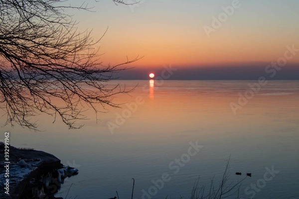 Obraz sunrise on the lake in winter