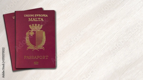 Fototapeta Malta passport on a wooden background, space for texts