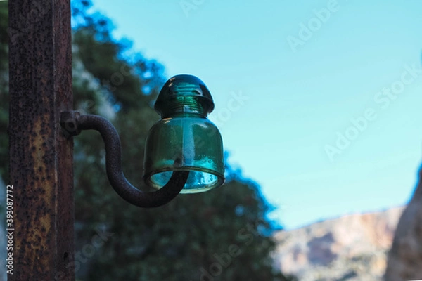 Fototapeta Old electrical insulator in glass