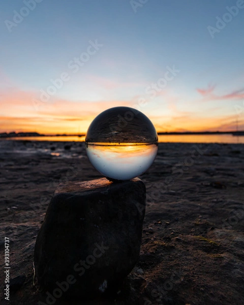 Obraz Beautiful sunset captured through a lens ball at the coastline