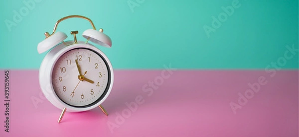 Fototapeta Alarm clock. Wake up early. Beautiful cute vintage alarm clock. Go to. 