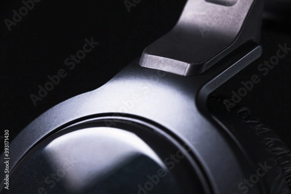 Obraz Elegant black headphones on black background with nice reflections