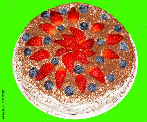 Fototapeta Handmade cake with strawberries and blueberries sprinkled with chocolate chips.