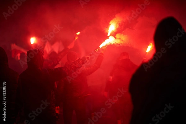 Obraz flaming red flare during a street protest in the city