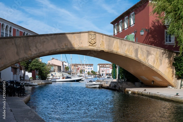 Fototapeta View on houses, roofs, canals and boats in Port Grimaud, Var, Provence, France