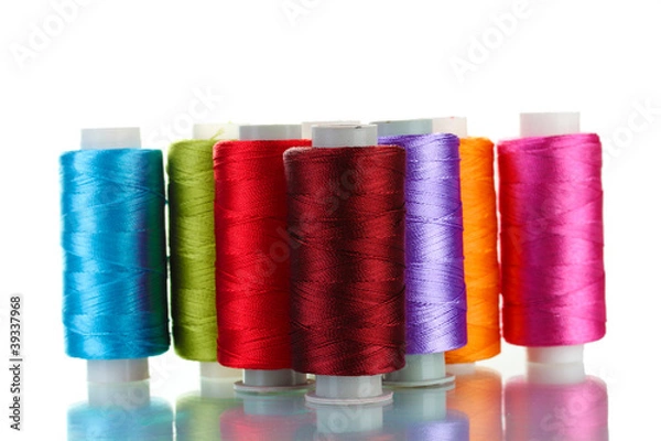 Fototapeta bright bobbin thread isolated on white.