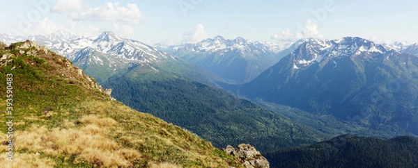 Fototapeta View from the top of hill covered with green grass