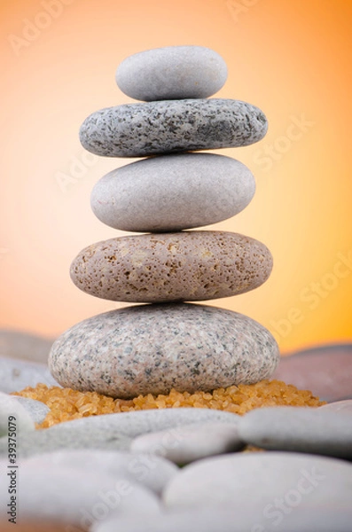 Fototapeta Balanced pebbles with colour background