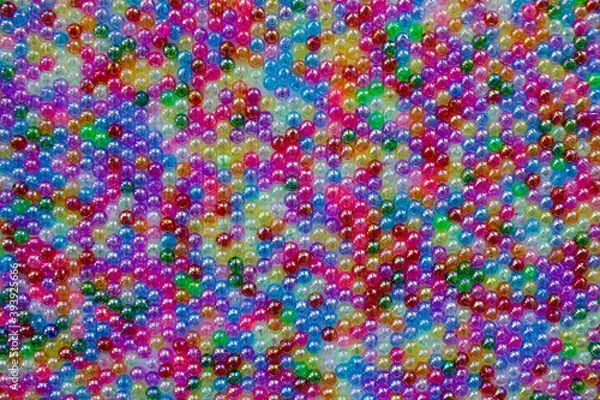 Fototapeta Set of transparent, shiny and many-coloured beads looking like soap bubbles. Seed beads for use in necklaces and bracelets.