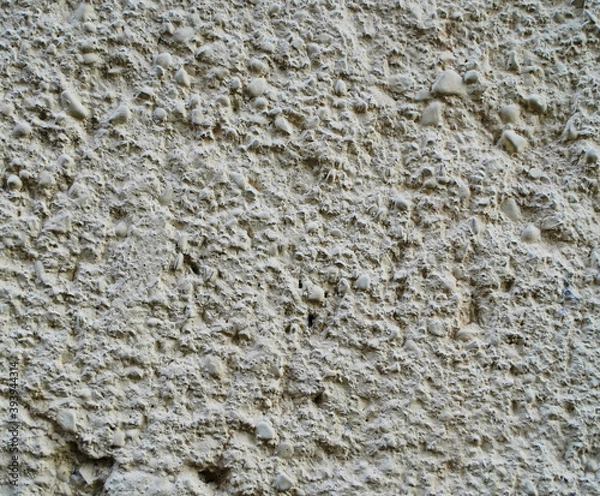Fototapeta Texture and background for the material. Unique pattern of gray cement texture in the pimples of the wall.