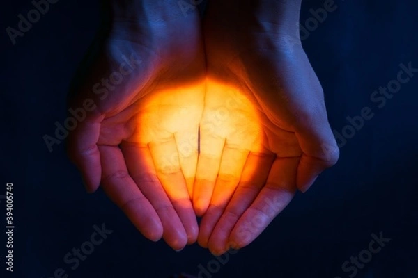 Fototapeta A Light in Cupped Hands