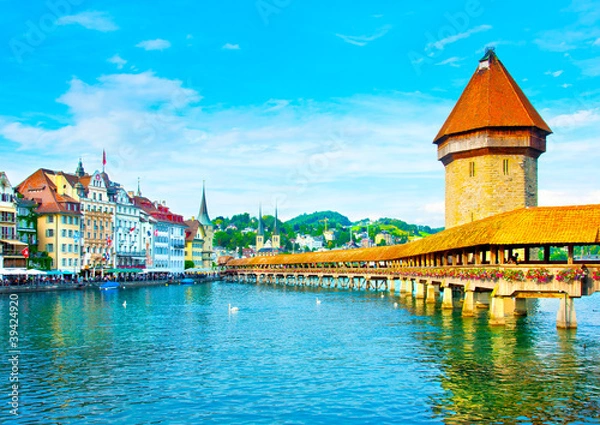 Fototapeta Panoramic vew of the older wooden bridge of Europe in Lucerne