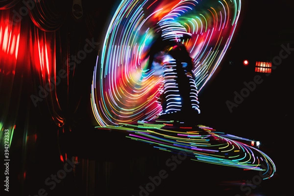 Fototapeta National Egyptian dance Tanura with diode illumination photographed at a long exposure in the camera