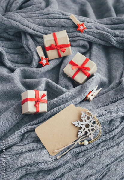 Fototapeta Merry Christmas blank card with snowflake, gift boxes and decorations on gray background.