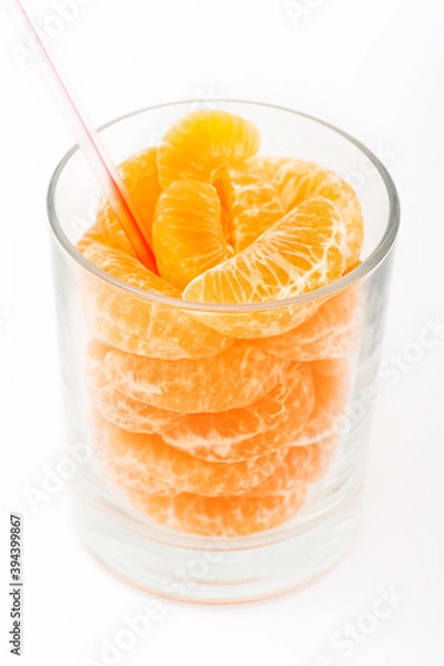 Obraz real natural orange juice with sliced in a glass. White background isolated.