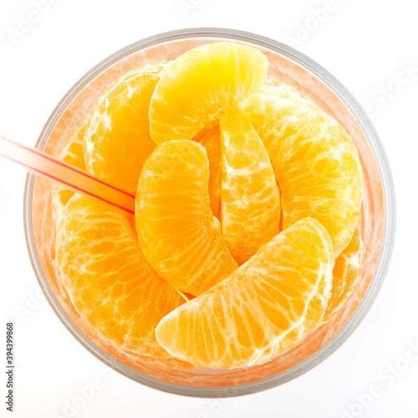 Obraz real natural orange juice with sliced in a glass. White background isolated.
