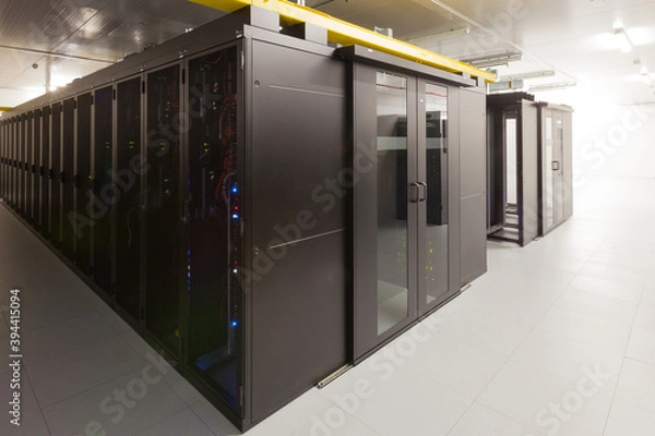 Fototapeta Network servers in a data center. Tier III carrier neutral data center. Server rooms.