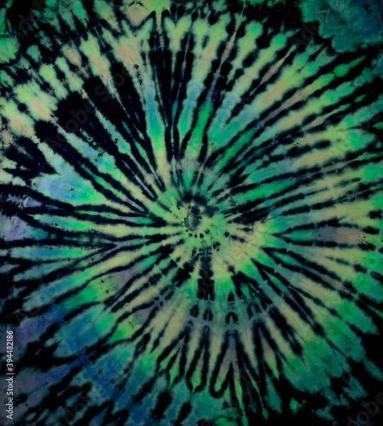 Obraz Spiral tie dye texture. Hippie tie-dye wallpaper. Boho festival tiedye background in green.