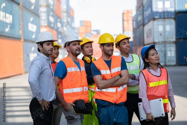 Obraz Team Logistics and transportation business Containers import concept .Engineering worker professional team a logistic or industrial container, Cooperation team corporate.