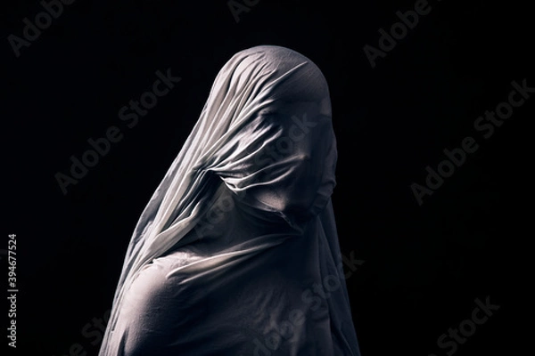 Fototapeta Portrait of a scary ghost isolated on black background