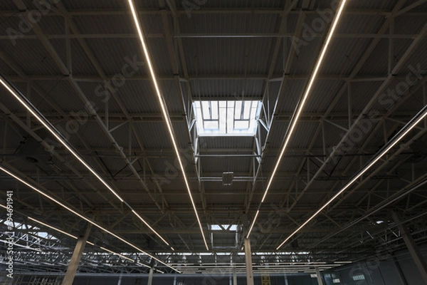 Fototapeta Interior of a new empty warehouse, wide angle view