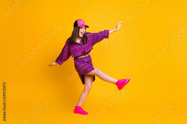Fototapeta Full size portrait of young person dance have fun looking empty space headwear isolated on yellow color background