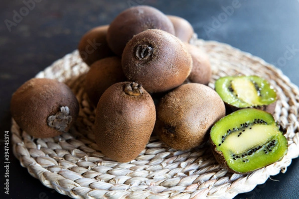Fototapeta kiwi on black  background. tinting. selective focus
