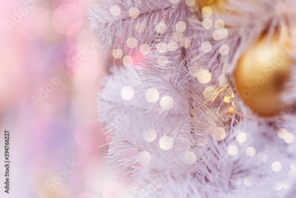 Obraz Christmas background of Golden balloons and garlands, on a pink background, blur. The concept of greeting cards for New year, Christmas and thanksgiving. Horizontal format, shallow depth of field