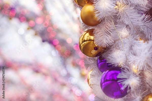 Obraz Christmas background of balloons and garlands, pink color, bokeh. Concept of a greeting card for New year, Christmas, and thanksgiving. Horizontal format, shallow depth of field
