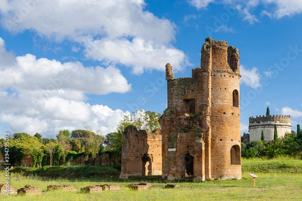Fototapeta Beautiful landscape of Circle of  Massenzio, Rome, tower and Cecilia Metella tomb in Appian way, with nature blue sky and clouds. Italy.