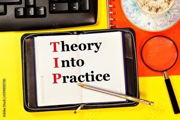 Fototapeta Theory into practice. Text label in the planning Notepad. Application of scientific knowledge in everyday life.