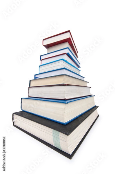 Fototapeta Books in high stack isolated on white