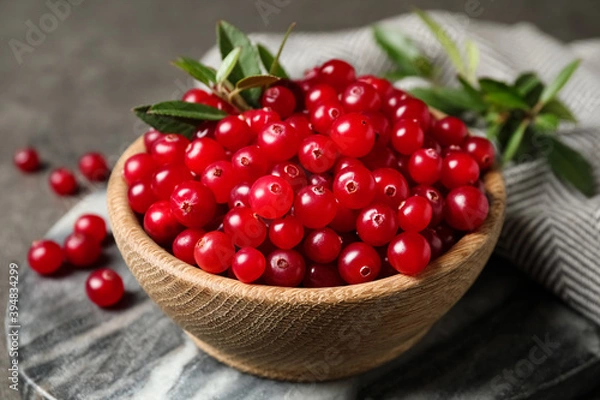 Obraz Tasty ripe cranberries on grey marble board, closeup
