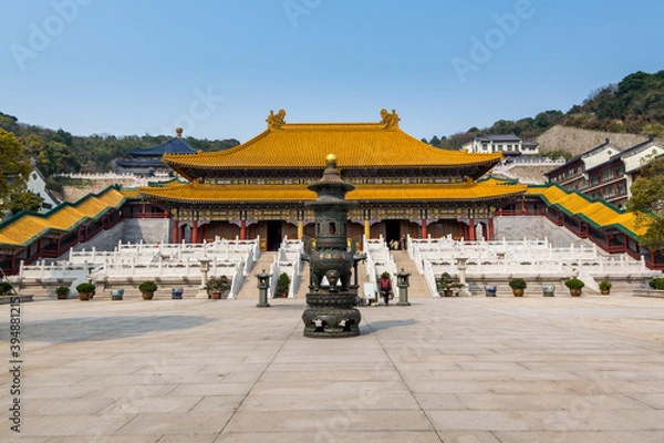 Fototapeta Chinese traditional royal style colorful temples in the Putuoshan mountains, Zhoushan Islands,  a renowned site in Chinese bodhimanda of the Guanyin