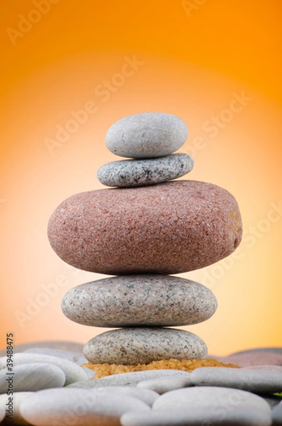 Fototapeta Balanced pebbles with colour background