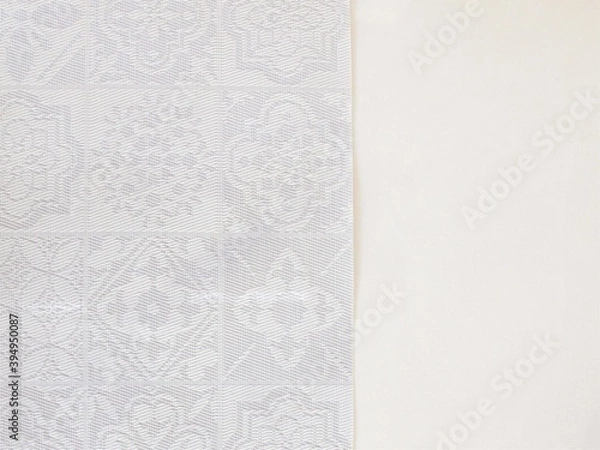Fototapeta Beige background with vertical side carved texture