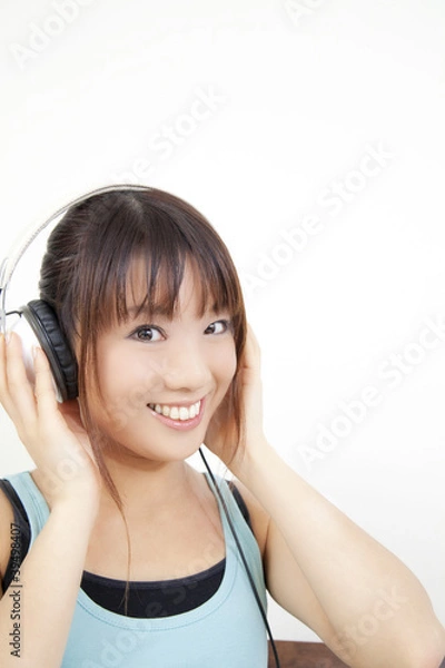 Obraz ヘッドホンで音楽を聴く女性