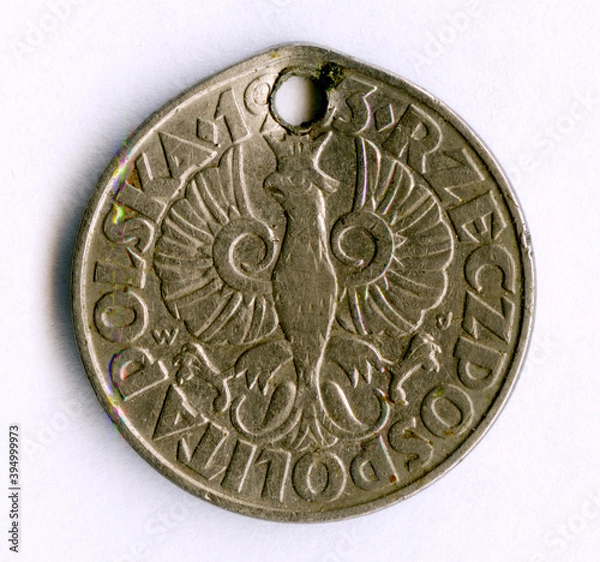 Fototapeta Old Polish 50 grosz coin from 1933. It was taken by Soviet soldiers as a trophy and was used by Bashkir women as an element of decoration.