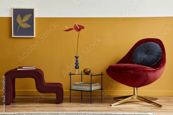 Obraz Unique living room in modern style interior with mock up poster frame, design red velvet armchair, elegant furniture, decoration and pesronal accessories in home decor. Honey yellow wall. Template.