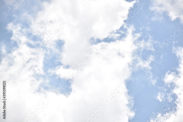 Obraz Blue sky with puffy white clouds.