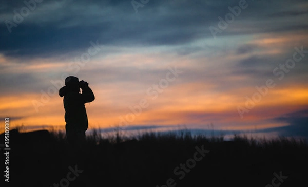 Obraz silhouette of a person with binoculars